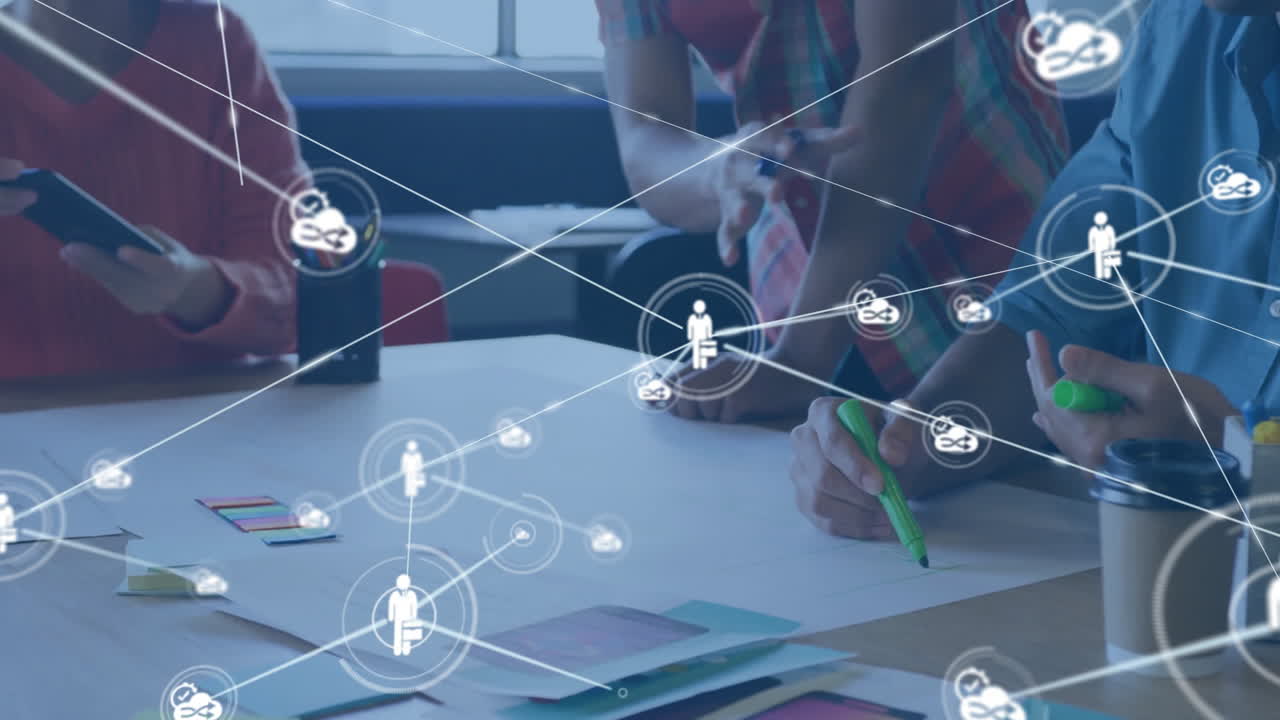 Collaborative team working at desk with network connections animation overlay