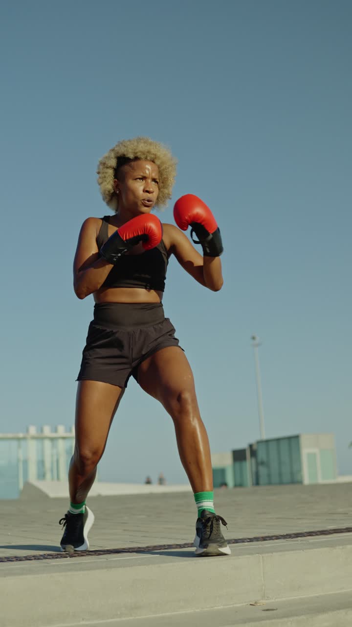 Woman boxing outdoors