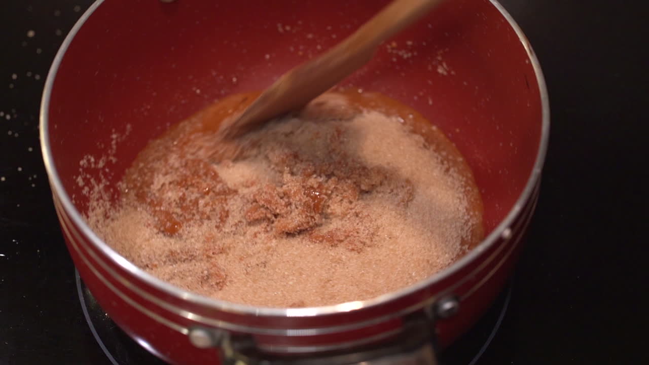 Making homemade caramel and adding brown sugar