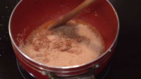 making homemade caramel and adding brown sugar