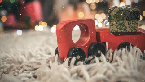 red toy car on a carpet in a living room decorated for christmas combined with falling snow