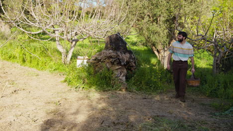farmer walks in nature with his wicker basket