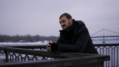 Man-standing-outdoors