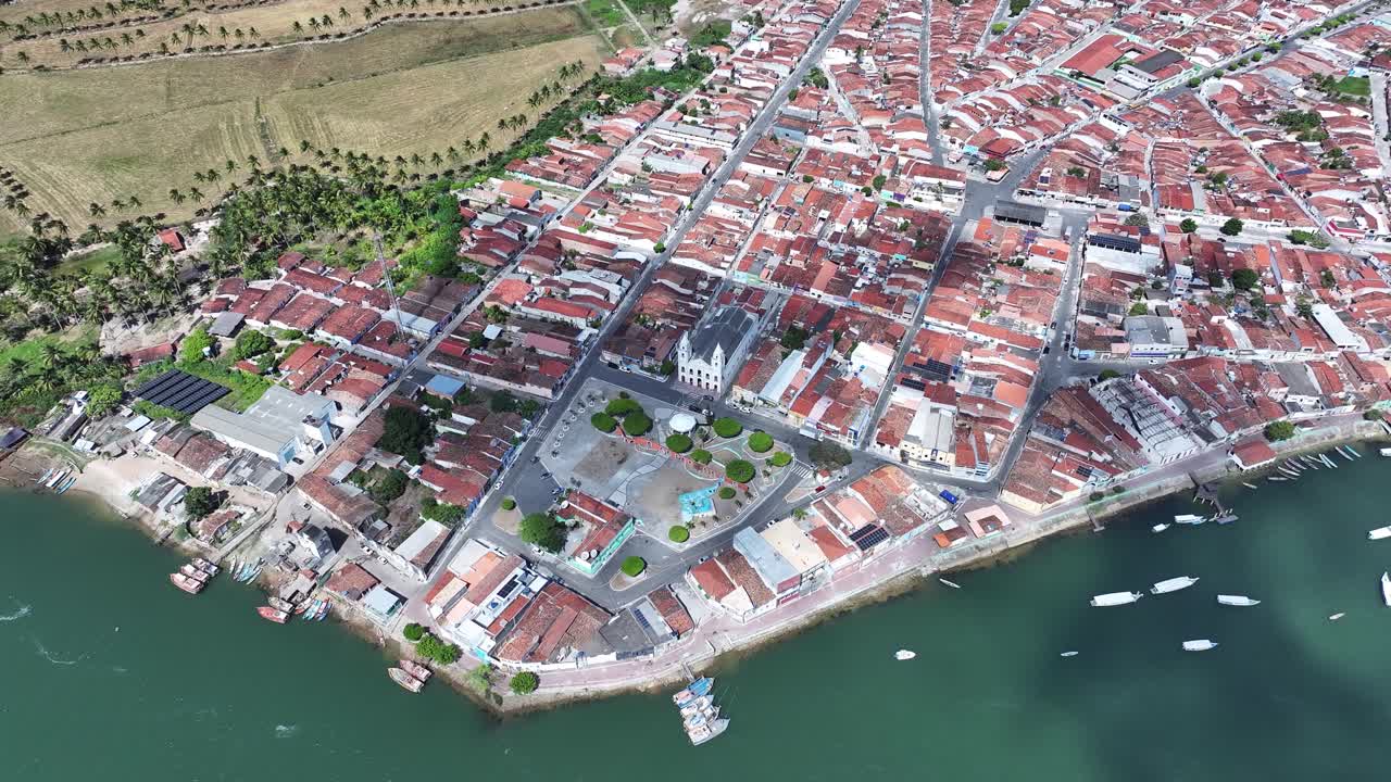 Drone view of houses next to the São Francisco River in the city of Piaçabuçu in the State of Alagoas