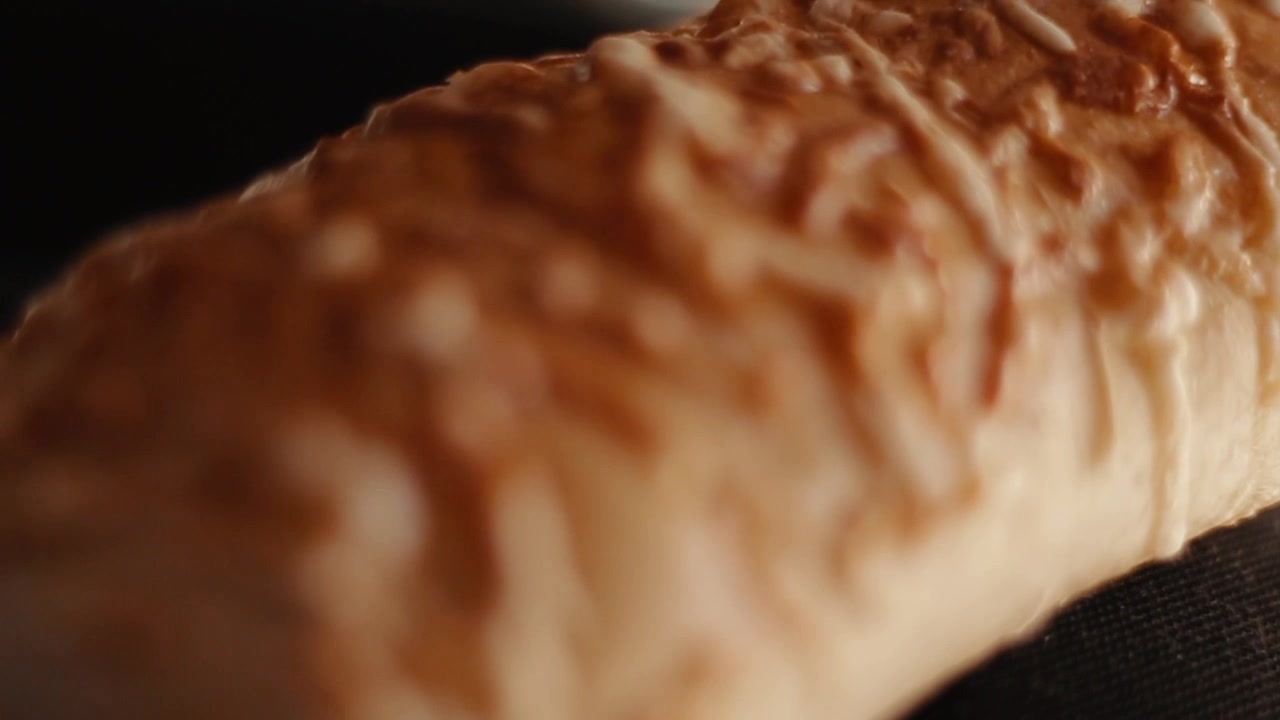 Slow motion clip of a tasty piece of bread