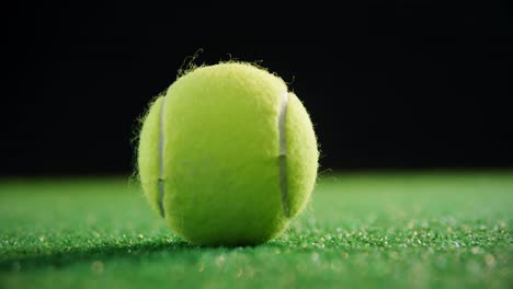 Close-up-of-tennis-balls-on-grass-4k