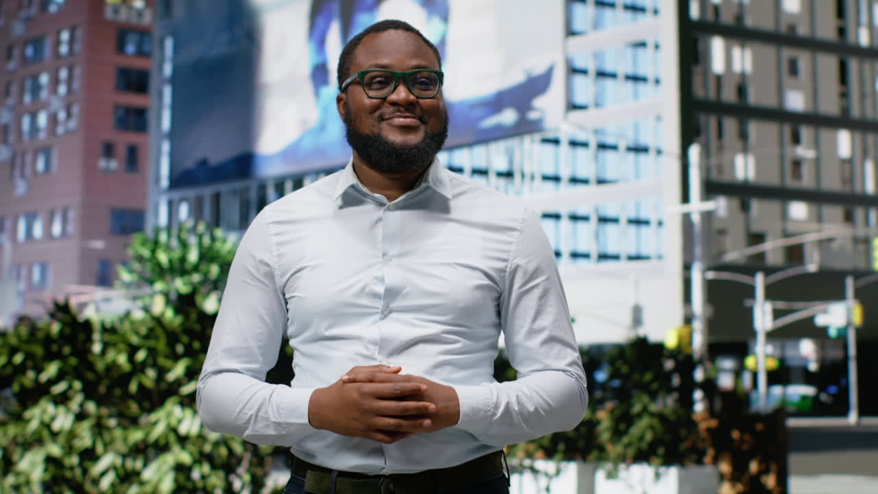 Portrait of black adult male standing out on a busy city street