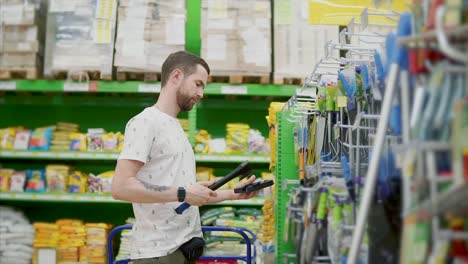 man shopping for tools in a hardware store