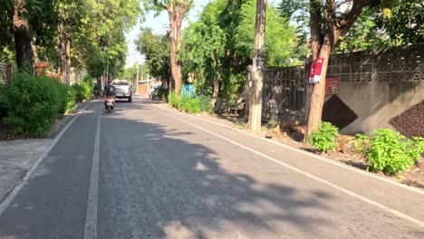 a vehicle's perspective of a suburban road