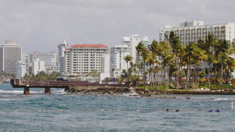 slow zoom out shot of view across el boqueron bay on windy day toward condando beach, puerto rico