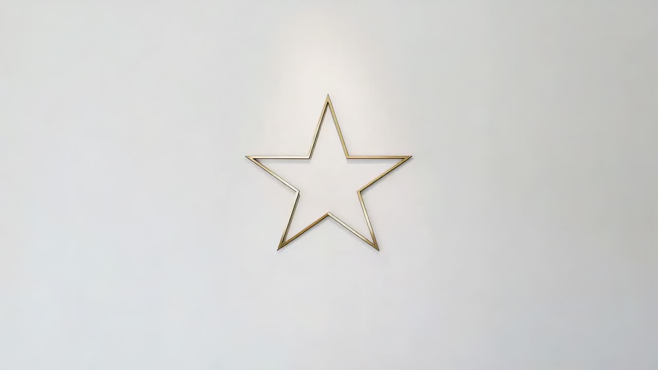 Camera pulling back revealing gold star tiling across off-white panel to fill frame, with shadows