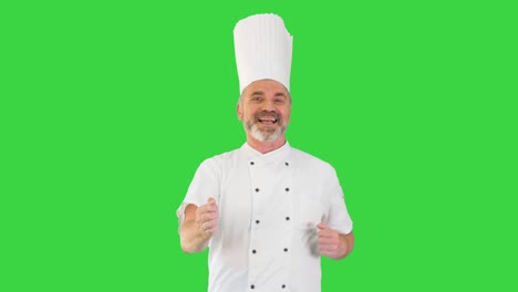 chef maduro con barba y en uniforme blanco bailando en una pantalla verde, clave de croma