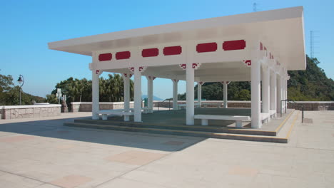 dolly shot towards a chinese pavilion built on the site of the former mountain lodge