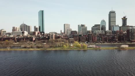 boston downtown skyline with iconic towers from the calm waters of charles river in massachusetts, usa