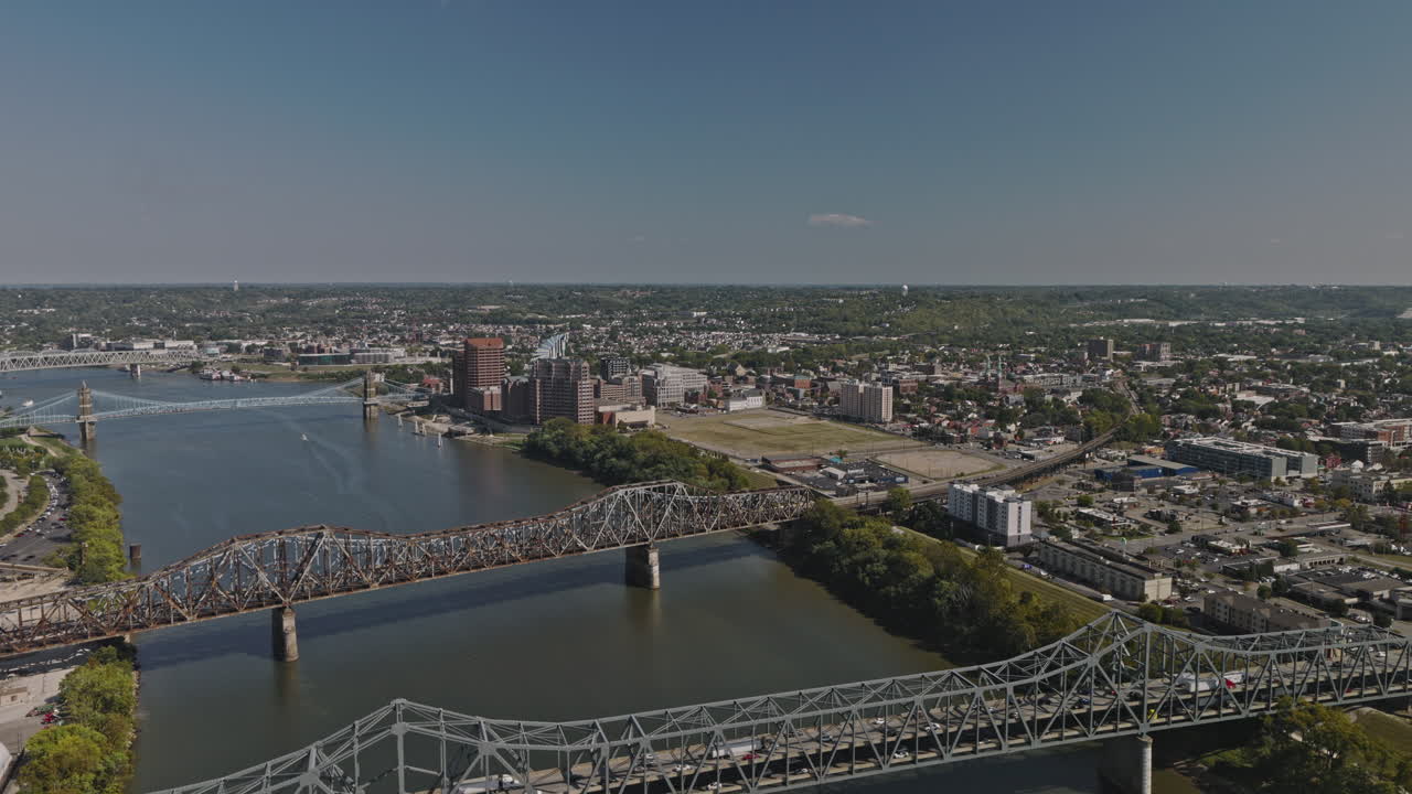 Cincinnati Ohio Aerial v16 drone flyover Brent Spence and Clay Wade Bailey Bridges spanning across the river capturing Covington cityscape and hillside views - Shot with Inspire 3 8k - September 2023