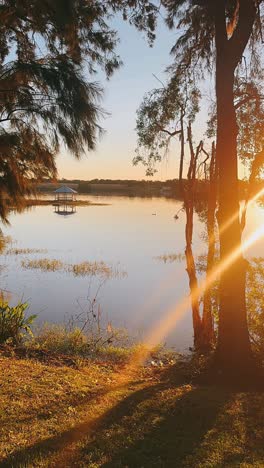 sunset gazebo on a calm lake