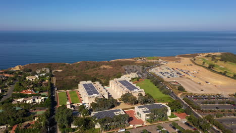 the salk institute on coastal cliff in la jolla with torrey pines gliderport in the background - aerial drone