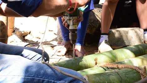 A-student-drilling-a-bamboo-using-a-drill-machine-during-a-workshop-conducted-at-an-architecture-college-in-Kerala