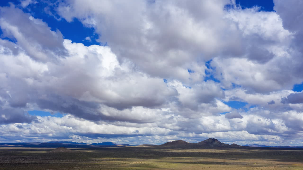 Drone Hyper Lapse Of Fluffy Clouds Forming Over The Mojave Desert