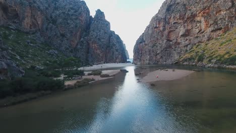 stunning 4k drone footage from sa calobra, mallorca in the serra de tramuntana mountains, epic landscape - massive cliffs - holiday in balearic islands