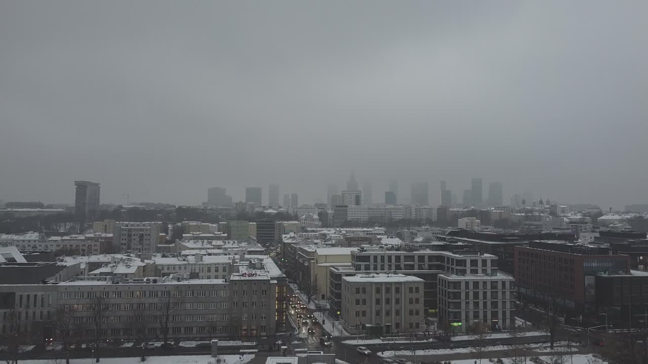 Drone video of warsaw city skyline on a snowy and foggy day9
