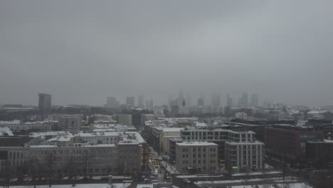 drone video of warsaw city skyline on a snowy and foggy day9