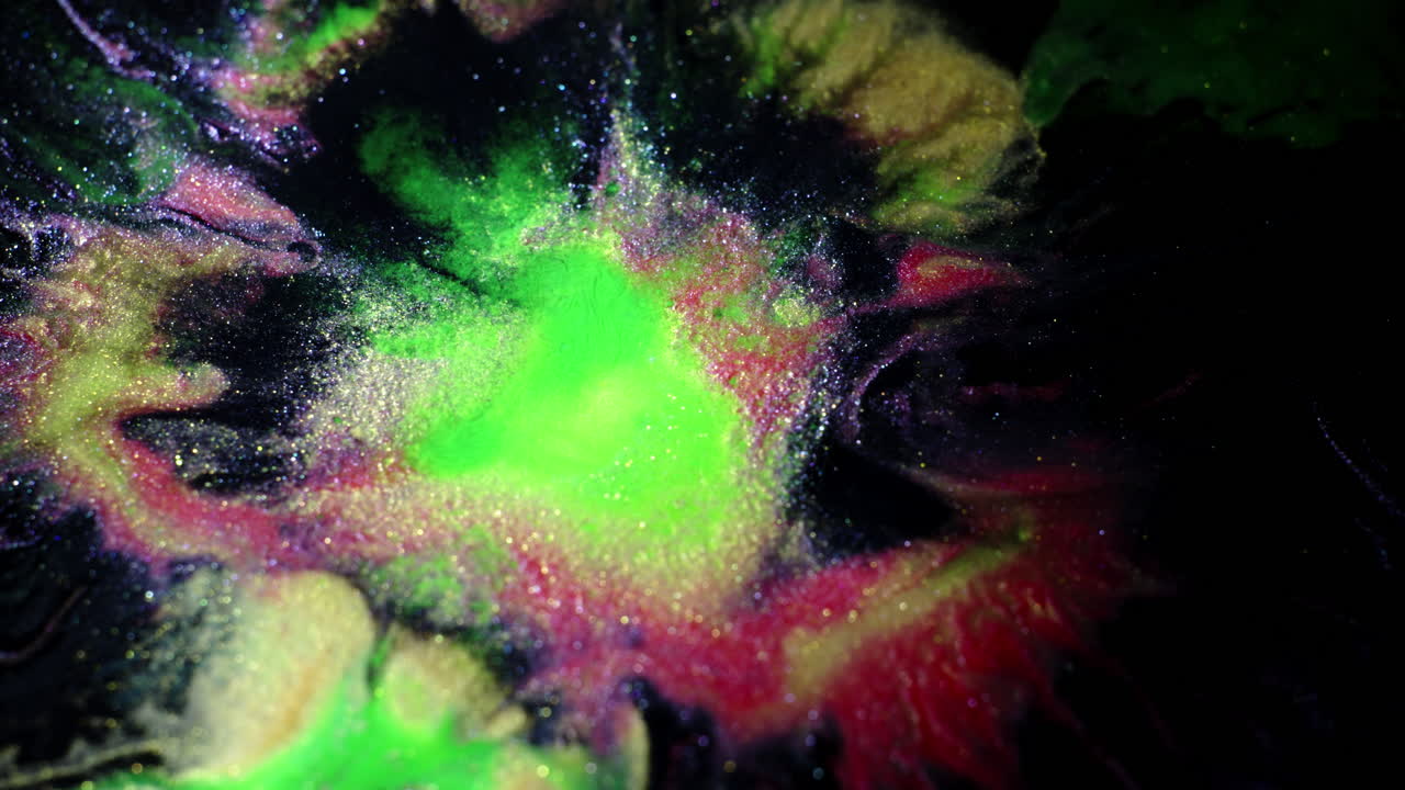 Vivid macro shot of colorful substances blending with dynamic motion