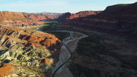 aerial flight over chinle rock formations in old paria canyon in vermillion cliffs, utah