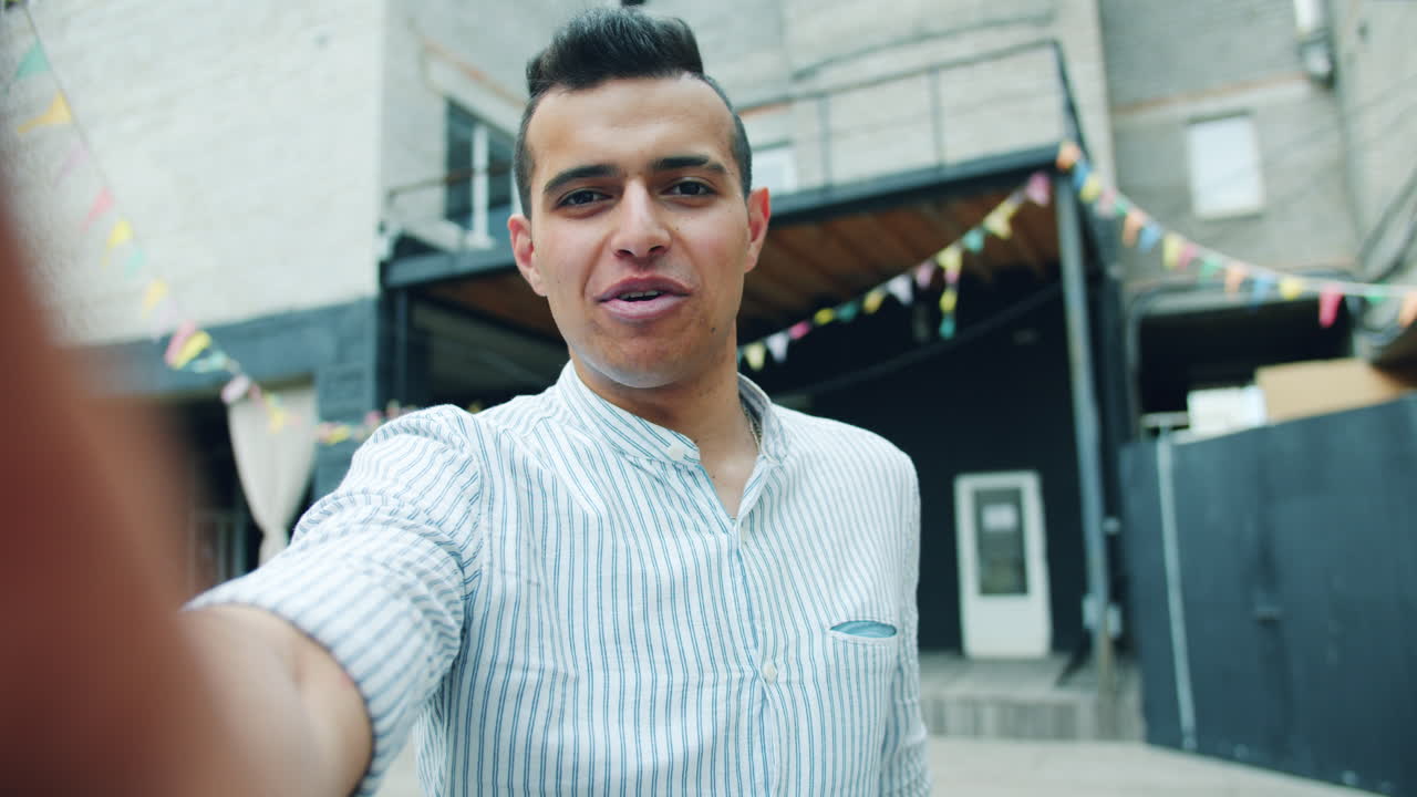 Man taking a selfie at a party