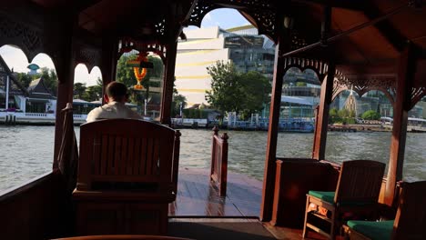 individual sitting peacefully by the water's edge