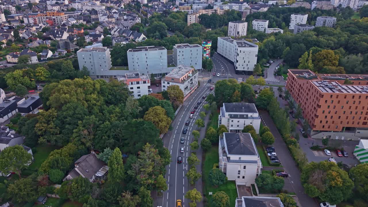 Aerial drone view of the La Courrouze district in Rennes, France. Modern apartment buildings and green spaces line the streets in this sustainable urban neighborhood development