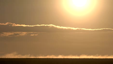 amazing sun rising through drifting clouds.