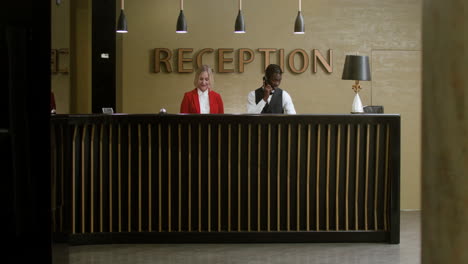 young man greeting the receptionists