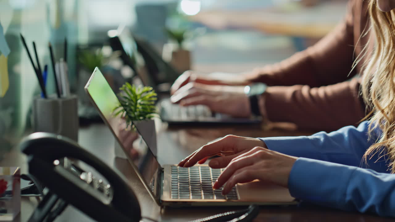 Focused man woman working office laptops closeup. Professional employees typing