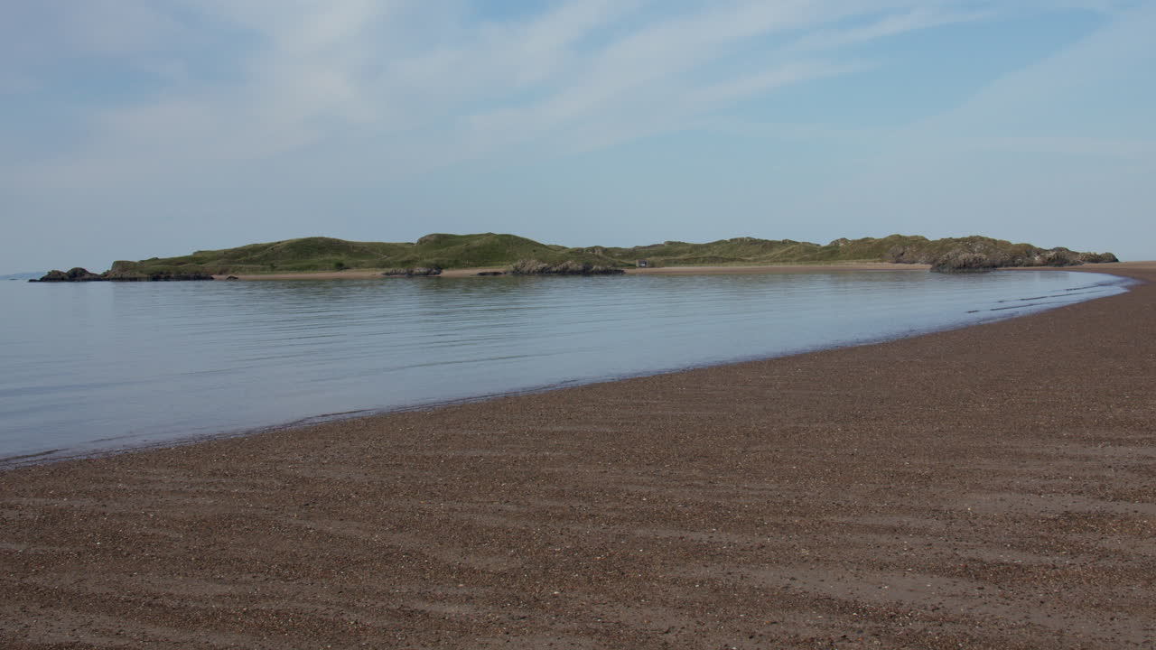 Wide shot of Ynys Llanddwyn island on Llanddwyn beach at the Newborough National Nature Reserve