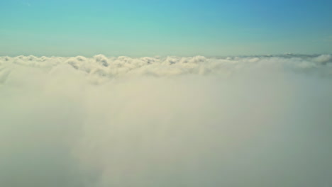 view of plane window, flying over the clouds with blue sky, sunny day