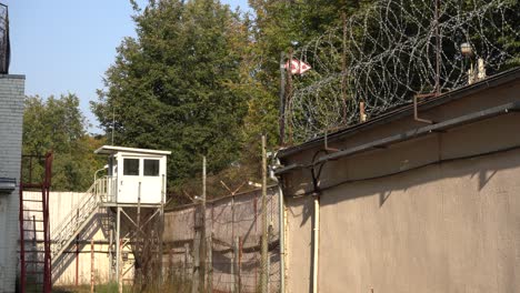 Coils-of-Barbed-Wire-on-Top-of-a-Fence