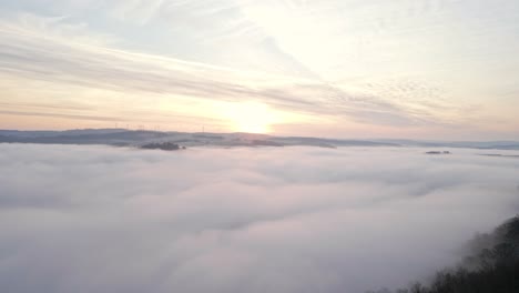 beautiful sunrise over the fog filled valleys of the westerwald mountain range