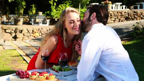 couple romancing in outdoor restaurant 4k