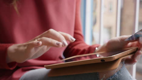 woman shopping with credit card using digital tablet at home