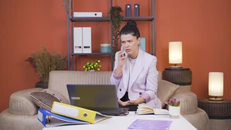 home office worker young woman having problems and stress on the phone.
