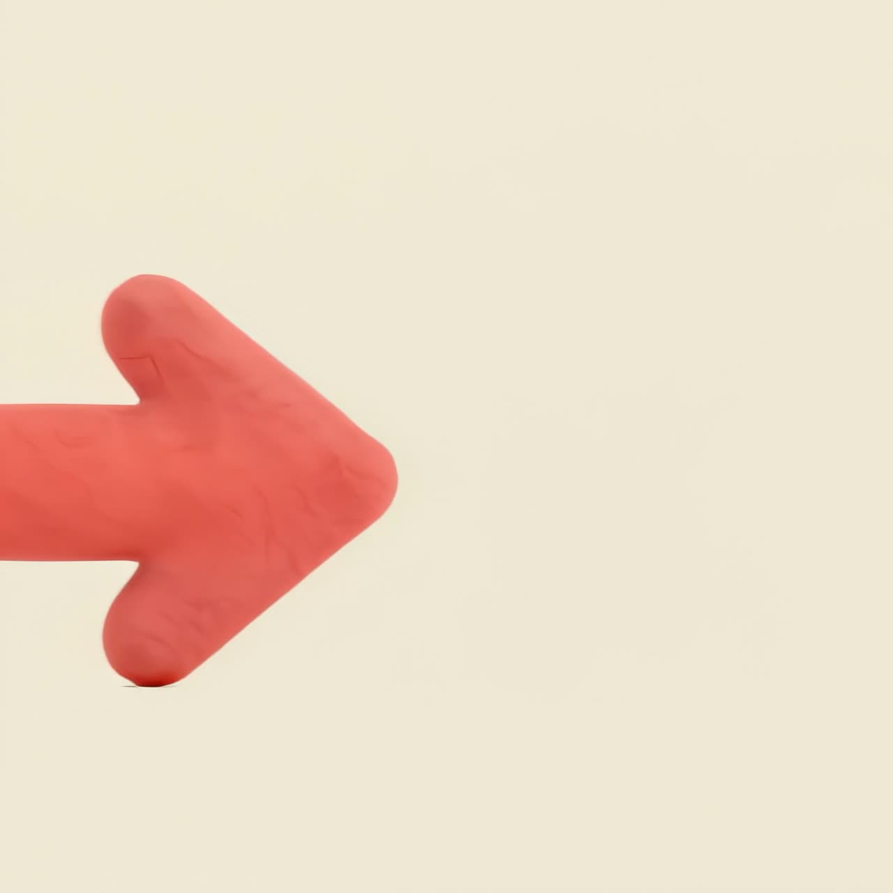 Red Clay Arrow and Rounded Shapes on Beige Background