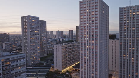 a surreal drone shot transforming olympiades into a dreamy nightscape