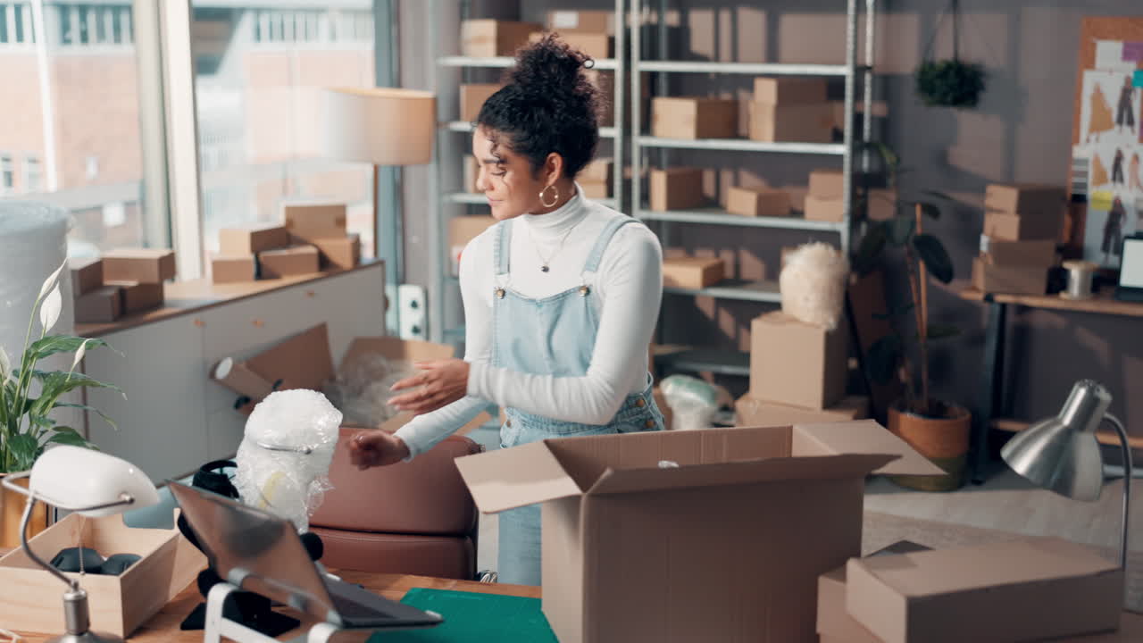 Woman packing boxes in a small business setting