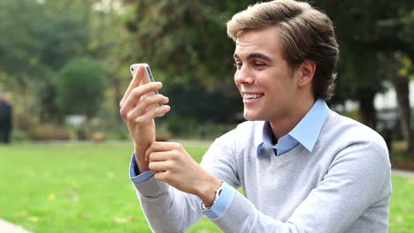 happy-man-video-messaging-chat-mobile-phone