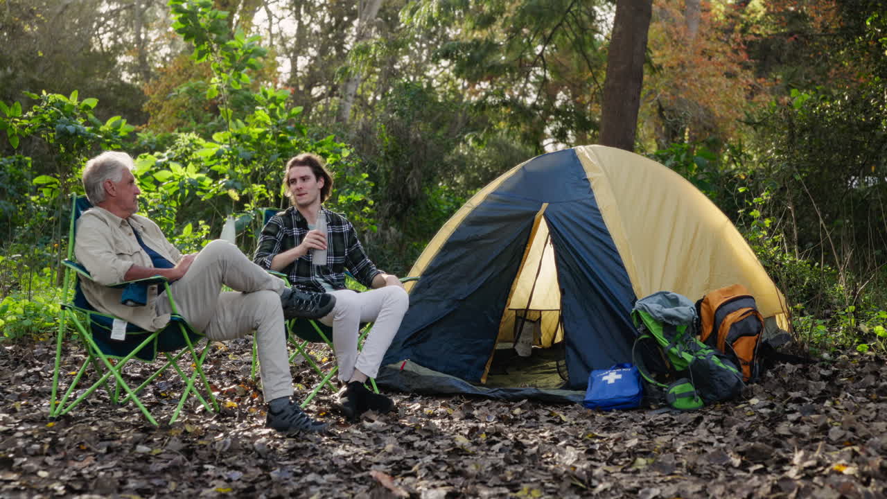 Father and son camping outdoors