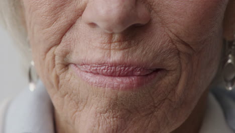 close up mouth of old woman smiling happy elderly female teeth dental health