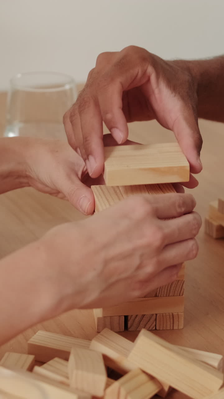 Couple Playing Jenga at Home