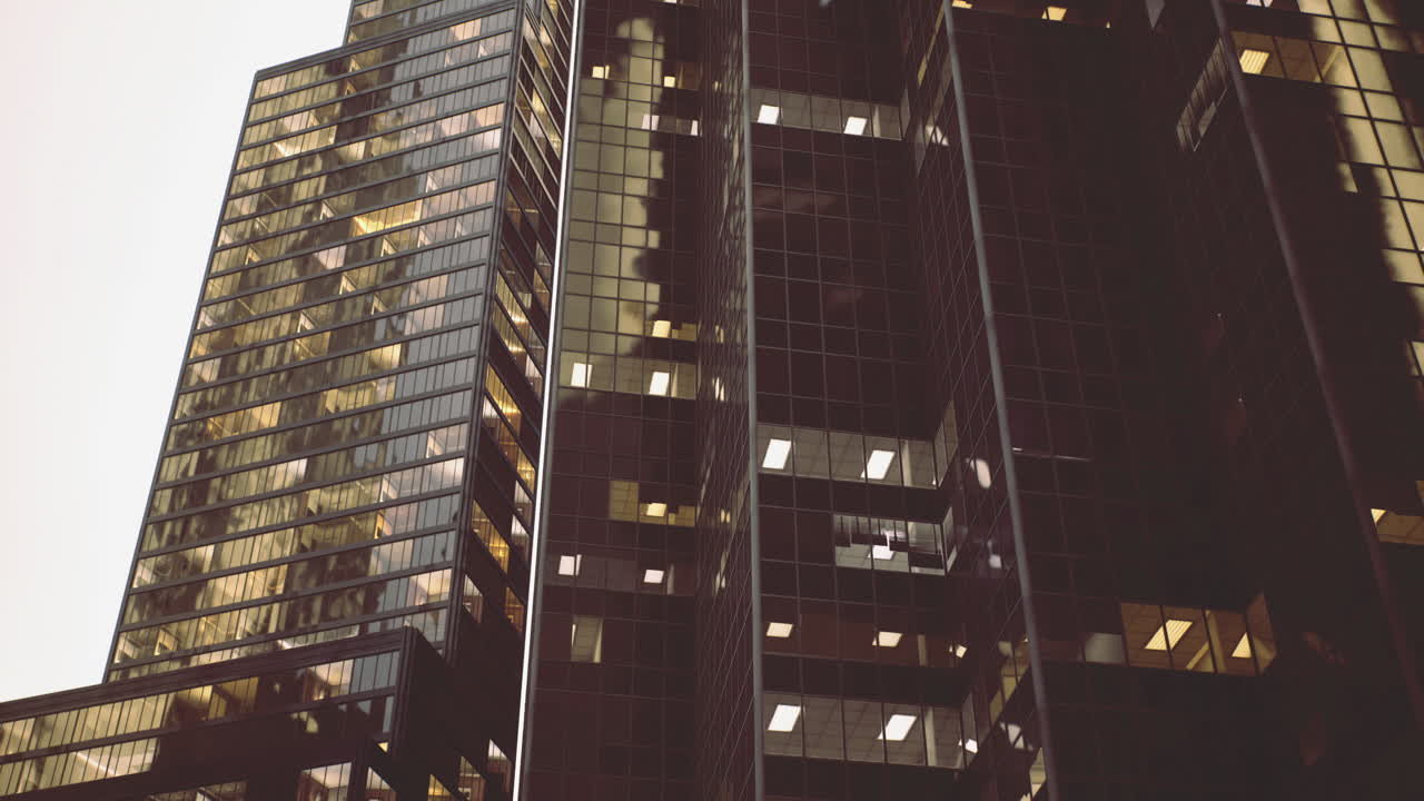 High rise buildings illuminated during evening in urban landscape
