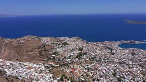 Aerial:-Slow-panning-drone-shot-of-Ermoupoli-city-in-Syros-island,-Greece-on-a-sunny-day